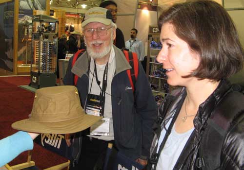 Alicia and Bill admire a Tilley hat